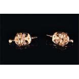 A pair of late 19th / early 20th century yellow gold earrings of oval form, decorated with floral