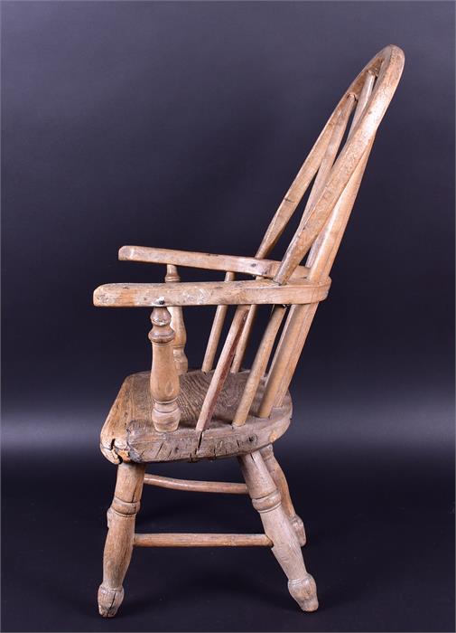 An early 20th century child's Windsor style armchair raised on turned supports, 65cm high x 33cm - Image 2 of 3