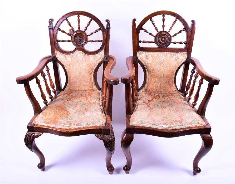 Two similar good quality 19th century carver arm chairs with turned ship's wheel backs one centrally