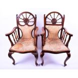 Two similar good quality 19th century carver arm chairs with turned ship's wheel backs one centrally