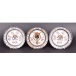 A group of three 19th century armorial plates with coats-of-arms, floral and gilt decoration, two