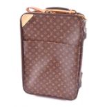 A Louis Vuitton monogrammed 55 Roll-on cabin suitcase with leather name tag and hand strap, and