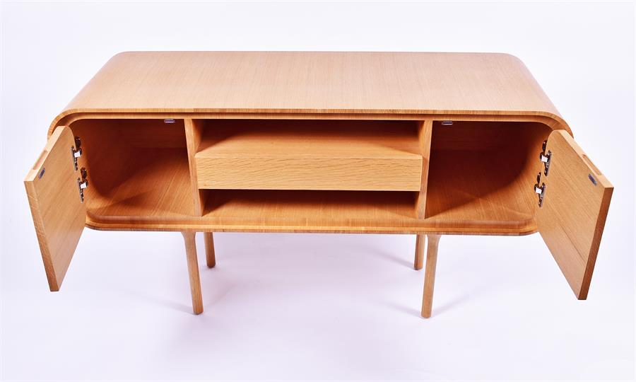 A Heal's sideboard in the 1960s style with a single central drawer between open shelves, flanked - Image 2 of 3