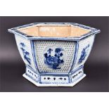 An early 18th century Chinese Kangxi period hexagonal blue and white jardiniere the sides with