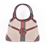A Gucci Reins Hobo bag in beige with green and red vertical stripes with brown leather fixtures,