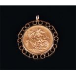 A Victorian 1898 22ct gold full sovereign in a 9ct gold mount. 9.6 grams.
