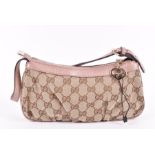 A Gucci Monogram Pochette  in beige with pale pink leather mounts, original dustbag, 11cm high x
