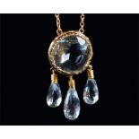 A yellow metal and aquamarine drop pendant necklace set with a rubover-set round cut aquamarine