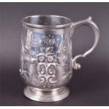 A George II Irish silver tankard unknown maker, Dublin 1727, with repousse foliate decoration and