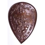 A Victorian bronzed cast iron wall hanging shield believed to be a replica of the parade shield of