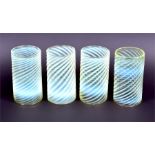 A set of four James Powell straw opal glass shades of cylindrical form with wrythen moulded