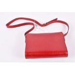 A Gianfranco Ferre red leather handbag  with goldtone hardware, still with shop tag. Labelled inside