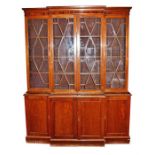 A reproduction triple cupboard bookcase the astragal glazed central two-door section flanked by