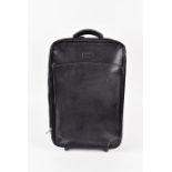 A Hartmann black leather cabin roll-on 56 cm long x 36 cm wide.  CONDITION REPORT Very good, minimal