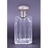 A large Edwardian scent bottle of ribbed body form with silver mount Birmingham 1906 by Arthur