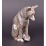 A silver model of a fox London 1985 by Wakely & Wheeler, in the seated position, 7 cm high.