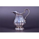 An early 19th century Irish silver cream jug  by James Le Bas, Dublin 1834, with loop handle and