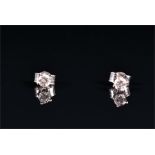 A pair of 18ct white gold and solitaire diamond ear studs set with round brilliant-cut diamonds,