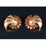 A pair of yellow metal and citrine earrings of scrolled design, with a semi-circle of oval-cut