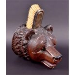 A wall hanging carved wooden Black Forest wall hanging pen or brush pot the detailed mask with