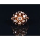 A 14ct rose gold, diamond, and enamel ring the openwork floral cluster set with seven individually-