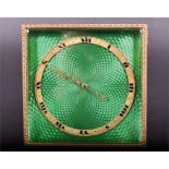 A 1920's green guilloche enamelled travelling clock the banded dial with black Roman numerals, 11.