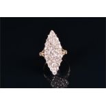 A yellow metal and diamond ring the navette-shaped mount set with old cut diamonds of