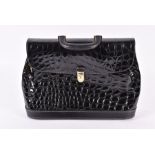 A Gianfranco Ferre briefcase in embossed crocodile patent leather  with goldtone closure and key.