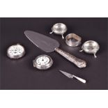 An assortment of silver items to include a silver napkin ring with bright cut decoration and