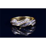 A 9ct yellow gold and diamond ring set with three interwoven rows of channel-set round brilliant-cut