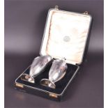 A cased silver presentation pair comprising a cream jug and sugar sifter Birmingham 1928, by