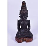 A 19th century carved and lacquered wood Thai Buddha  the seated figure with traditional dress, on a