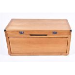 A contemporary oak trunk with campaign style handles, 50cm high x 110cm wide x 49cm deep.