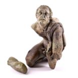 Italian Grand Tour school a weathered serpentine study of a cloaked seated male figure,