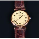 A Must de Cartier silver gilt quartz wristwatch the cream dial with black Roman numerals, jewelled