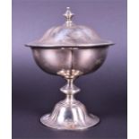 A Russian silver cup and cover of stylised melon form, on a spreading pedestal foot, removable cover