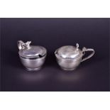 A pair of George V silver mustards London 1912 and 1913, maker's mark indistinct, of circular bowl