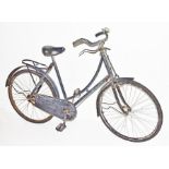 A circa 1920s and later ladies bicycle the frame 120cm long, with split rubber pedals, rear carry