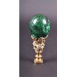 A late 19th century seal with polished malachite handle and gilt metal mount.