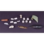 A collection of seventeen various jade and hardstone carvings to include a carved shell, a fish, a