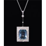 A white metal, diamond, and aquamarine pendant in the Art Deco taste, (mount tests as gold), set