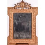 A late 19th century French gilt framed mirror with mythical beast and shield surmount, the border