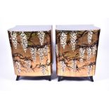 A pair of 1950s two-drawer bedside cabinets with black lacquered top and painted Japanese style