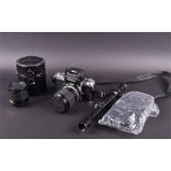 A Nikon F2 camera and accessories  numbered F2 8065540, fitted with a 43-86 mm lens, together with a