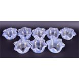 A matching set of eight Stevens & Williams opalescent tinted clear glass finger bowls of cylindrical