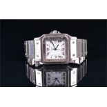 A Cartier Santos stainless steel automatic wristwatch the square white dial with black Roman