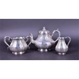 A late Victorian three piece silver plated tea set by Martin Hall & Company Ltd, Sheffield,