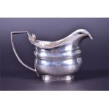 A George III silver cream jug by John Watson , Newcastle, 1803, of classical form with reeded handle