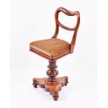 A Victorian revolving mahogany harp chair with upholstered seat of small proportions, on a shaped