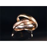 Must de Cartier, an 18ct three colour gold 'Trinity' ring signed to the outer shank, numbered